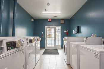 A laundromat with washers and dryers